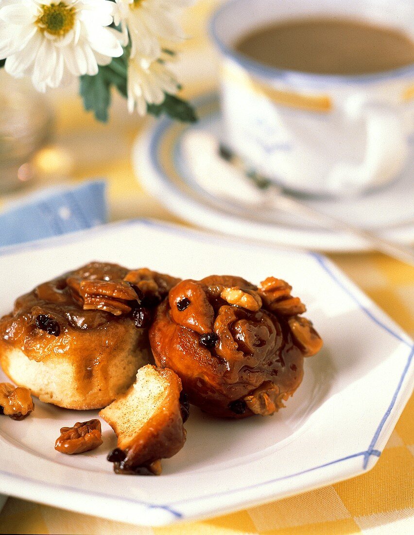 Two Sticky Buns On a Plate For Breakfast