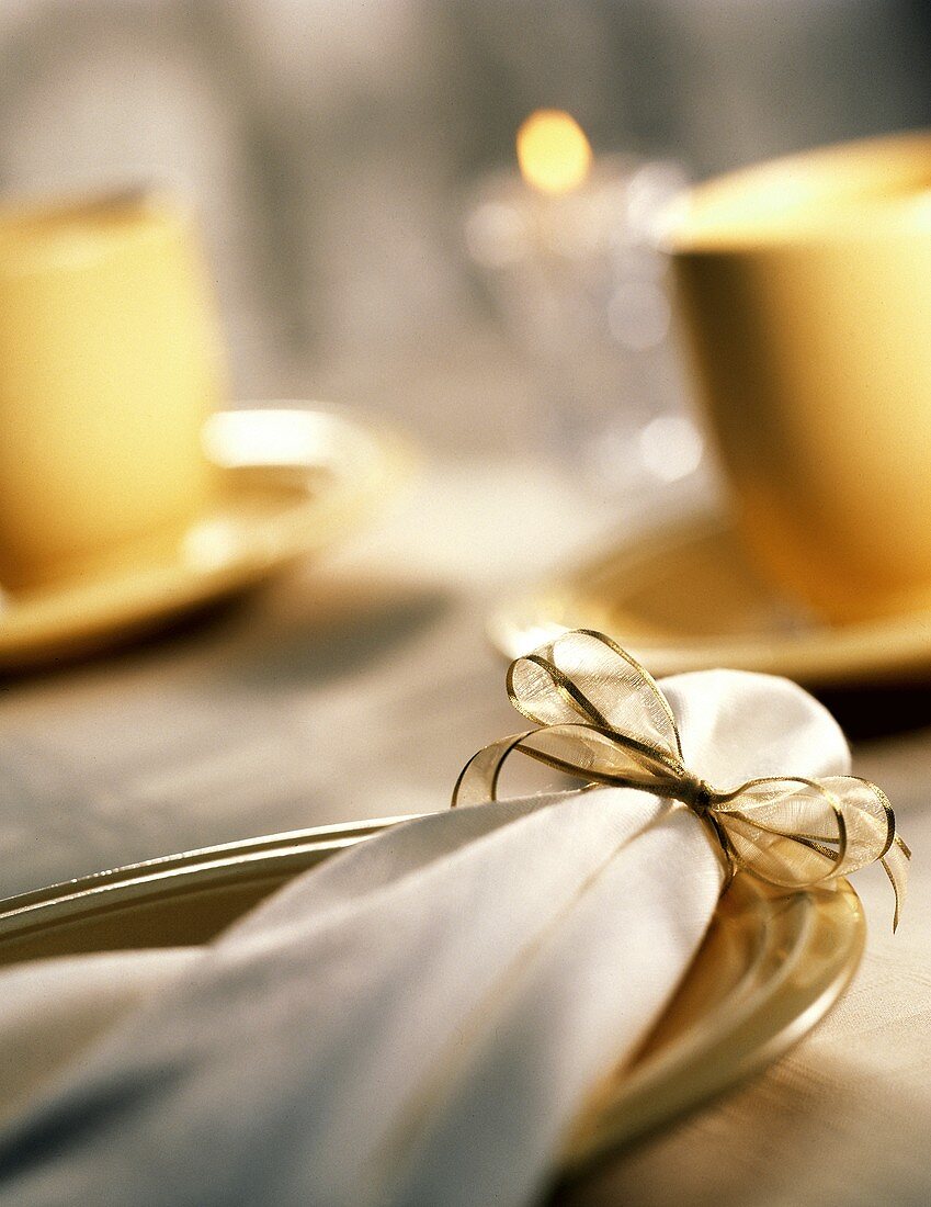 Holiday Place Setting; Cloth Napkin with Gold Ribbon