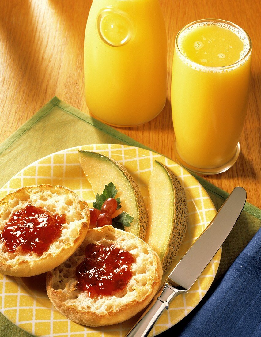 English Muffin with Jam and a Glass of Orange Juice