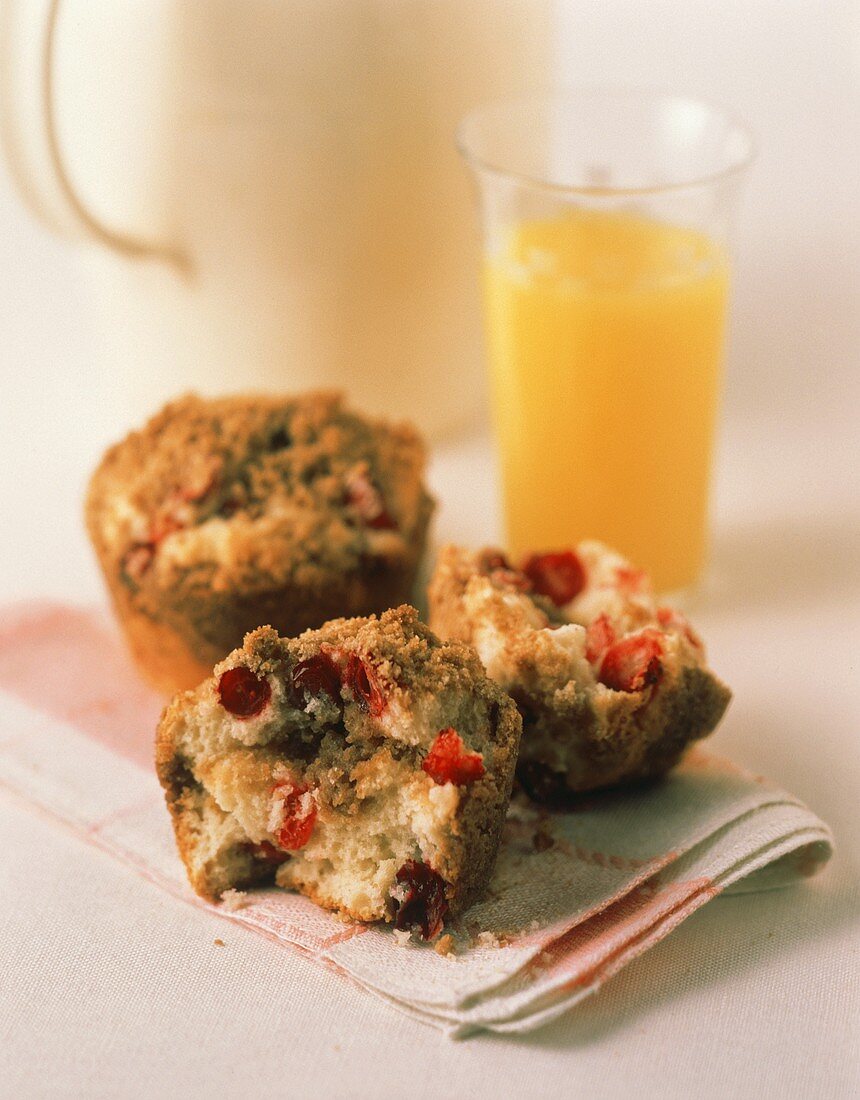 Two Cranberry Muffins; One Cut in Half