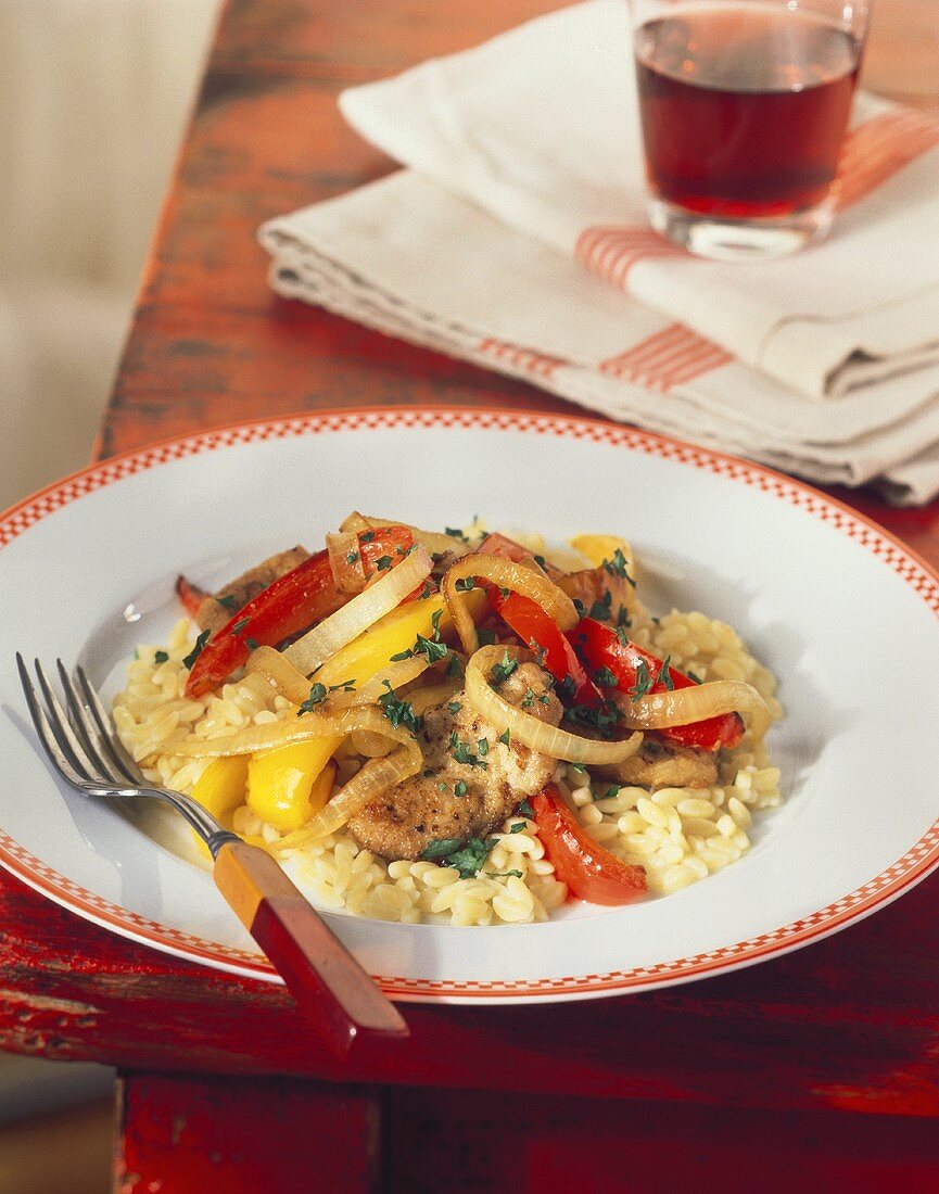 Breaded Chicken with Sauteed Peppers and Onions Over Orzo