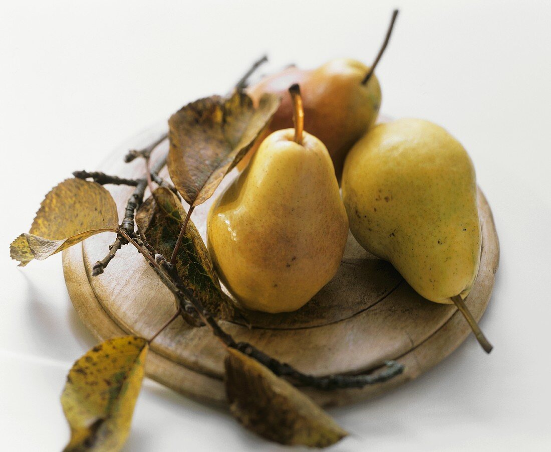 Three Pears on a Wooden Plate; Leaves