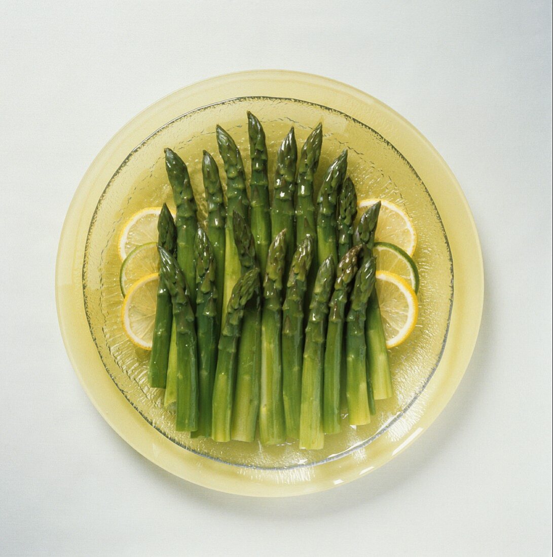 Boiled Asparagus Spears on a Plate with Lemon