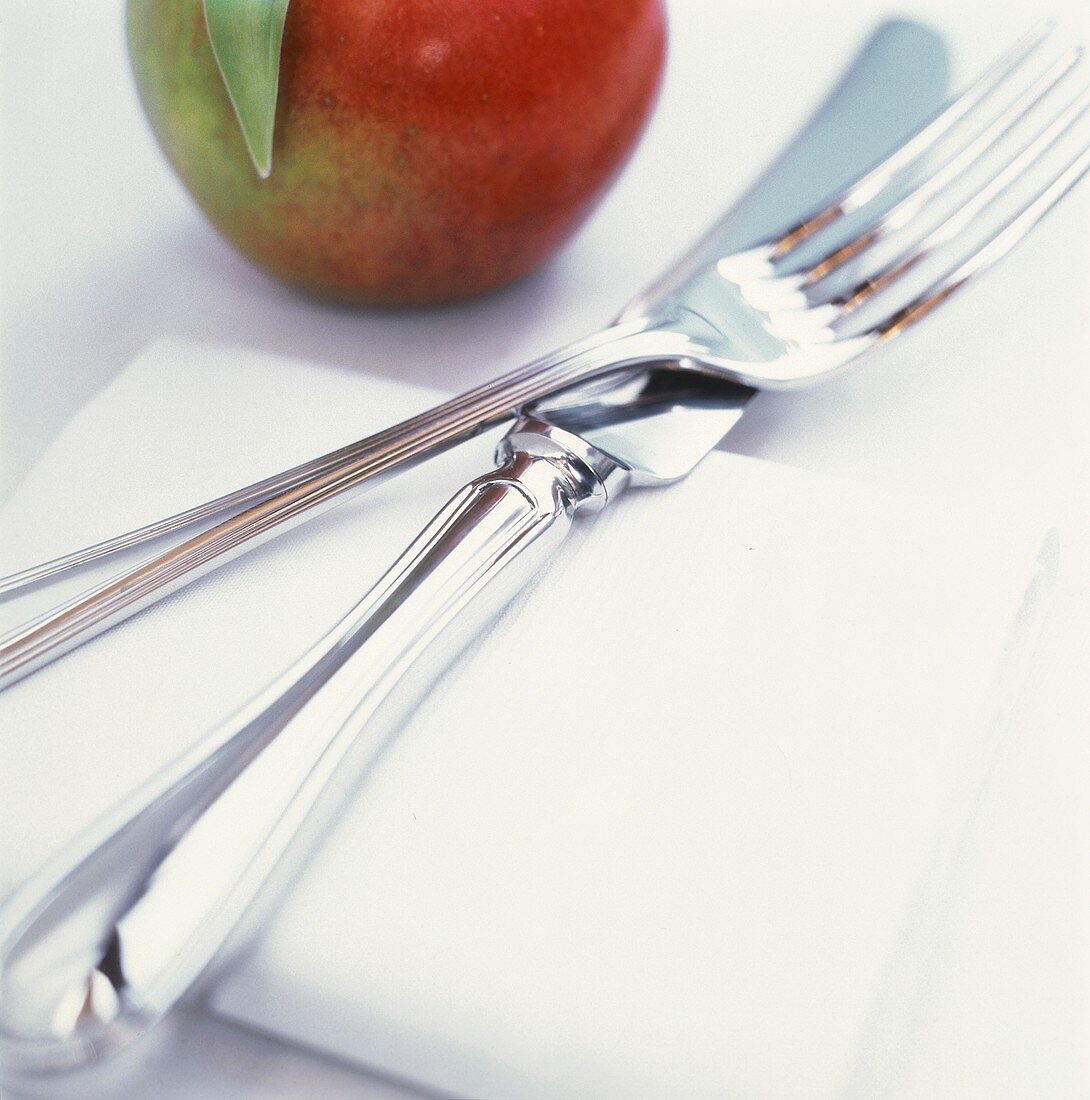 Fork and Knife on Napkin; Apple