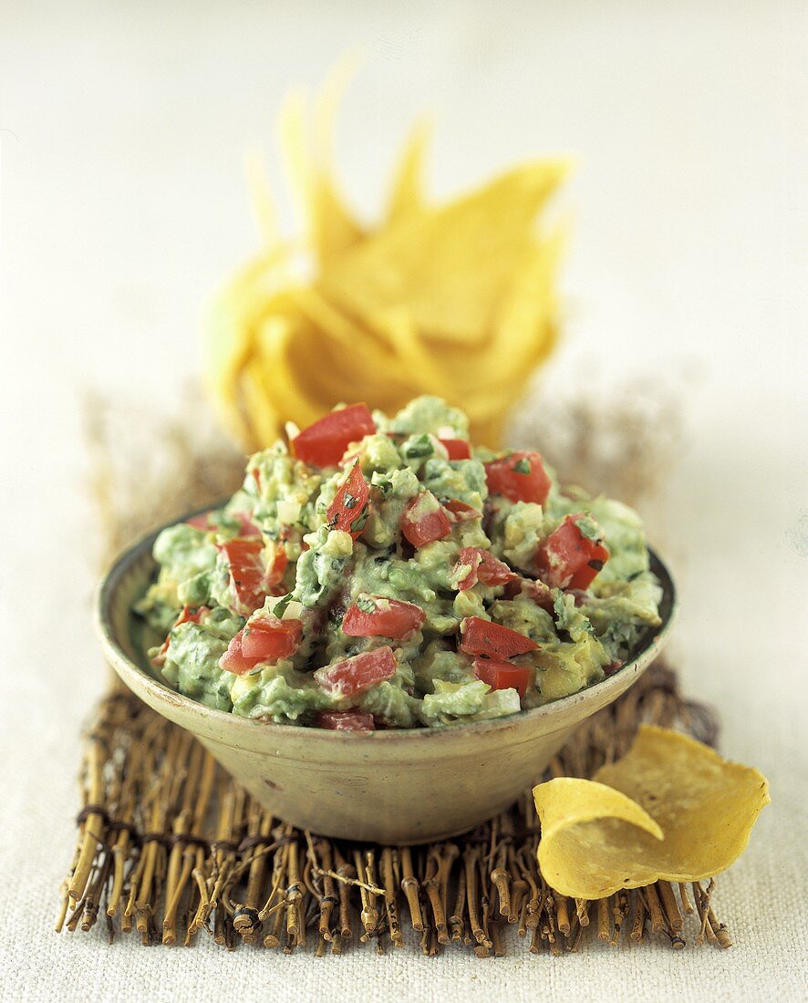 A Bowl of Guacamole with Tomato