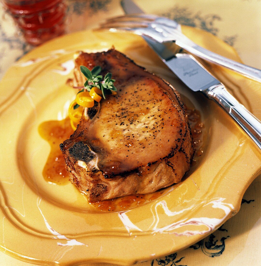 A Single Pork Chop with Orange Glaze