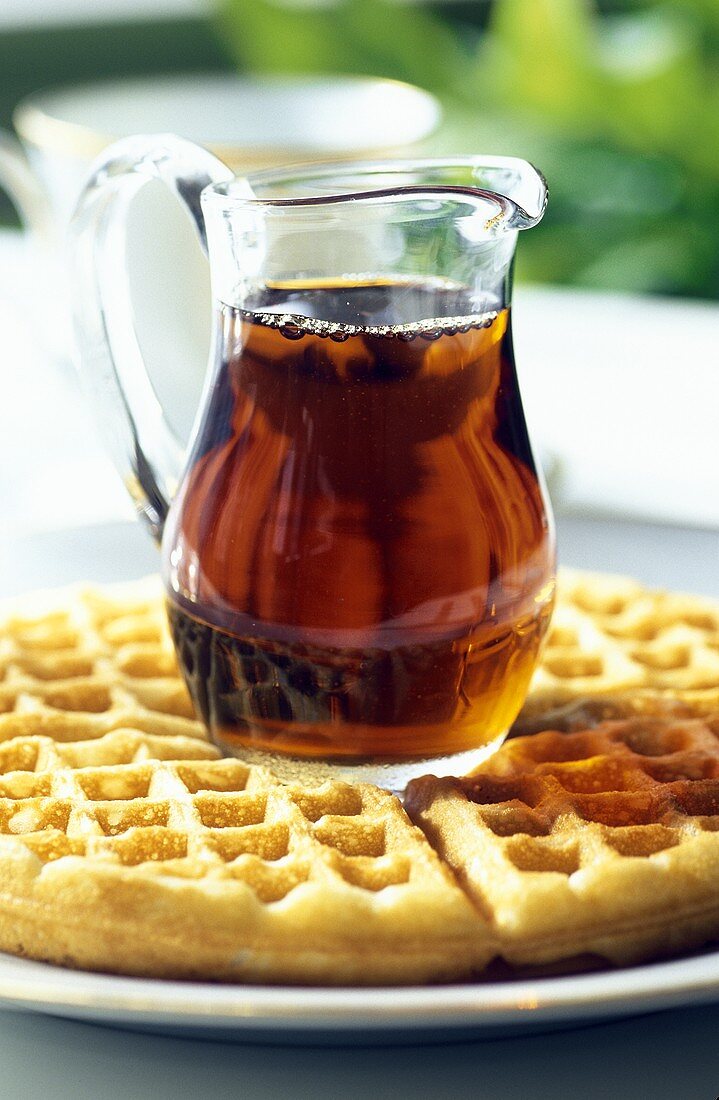 A Pitcher of Maple Syrup on Waffles