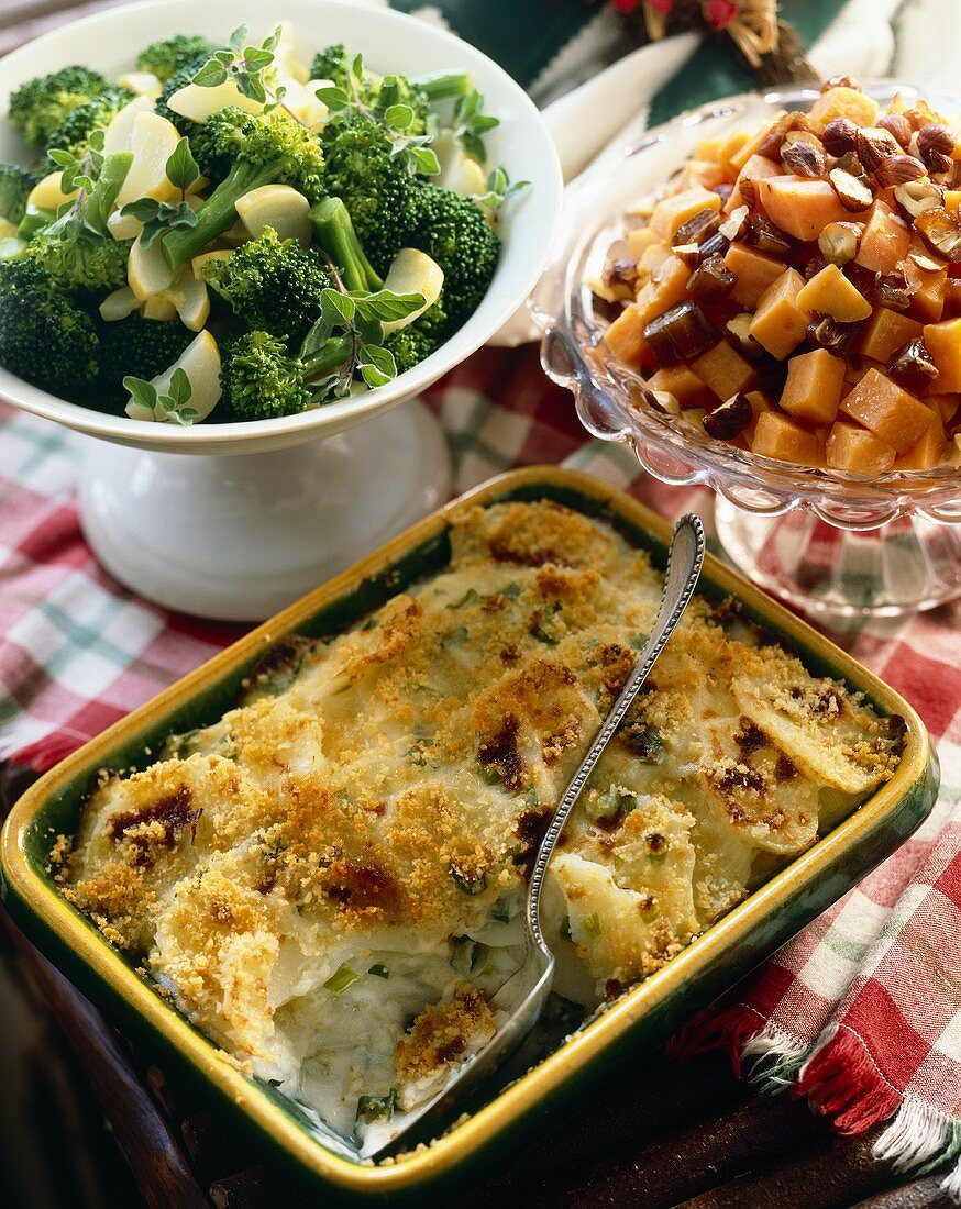 Three Side Dishes in Serving Bowls; Broccoli, Sweet Potatoes and Potatoes