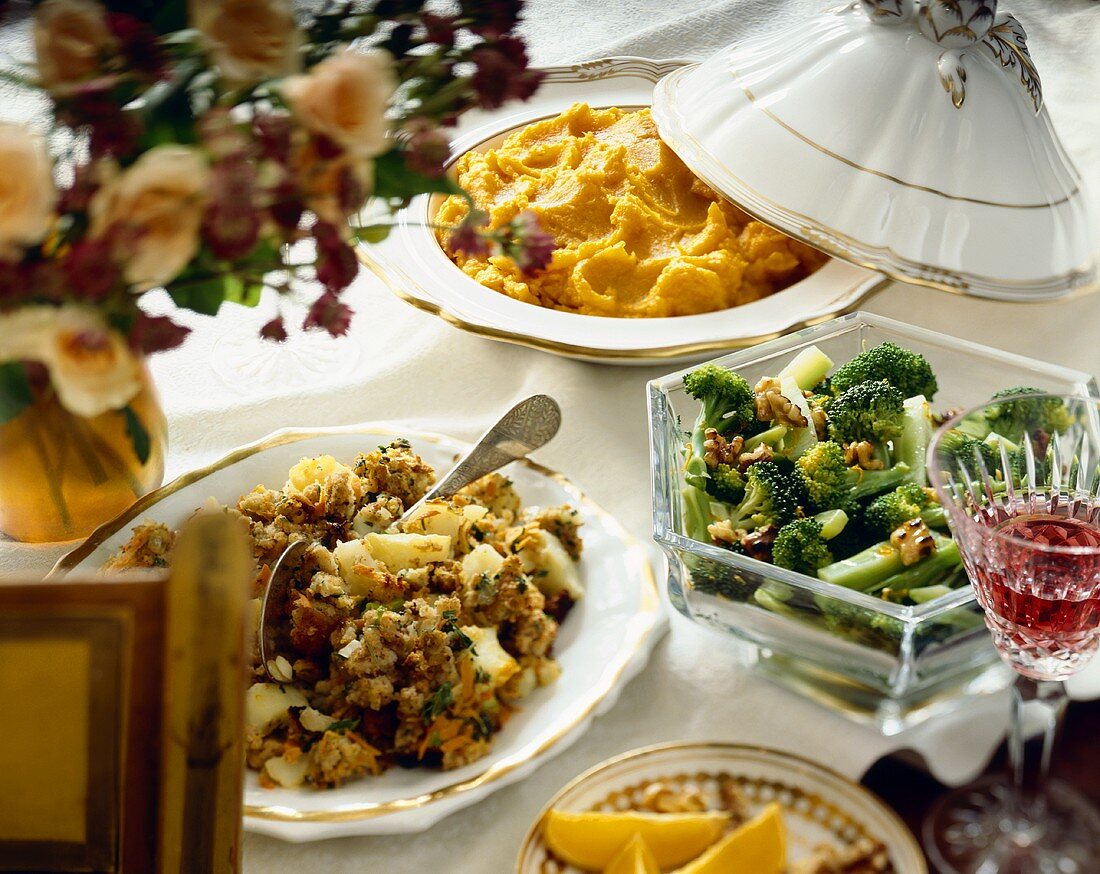 Three different sides of vegetables in serving bowls on a table