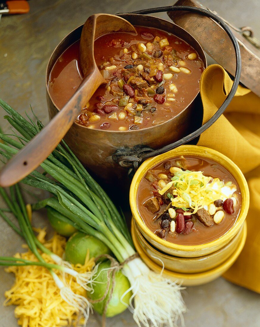 Beef Chili in a Large Copper Pot and Serving Bowl; Large Wooden Scoop