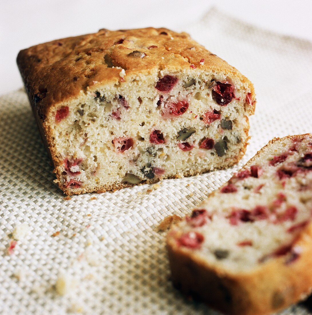 Cranberry and walnut bread, partly sliced