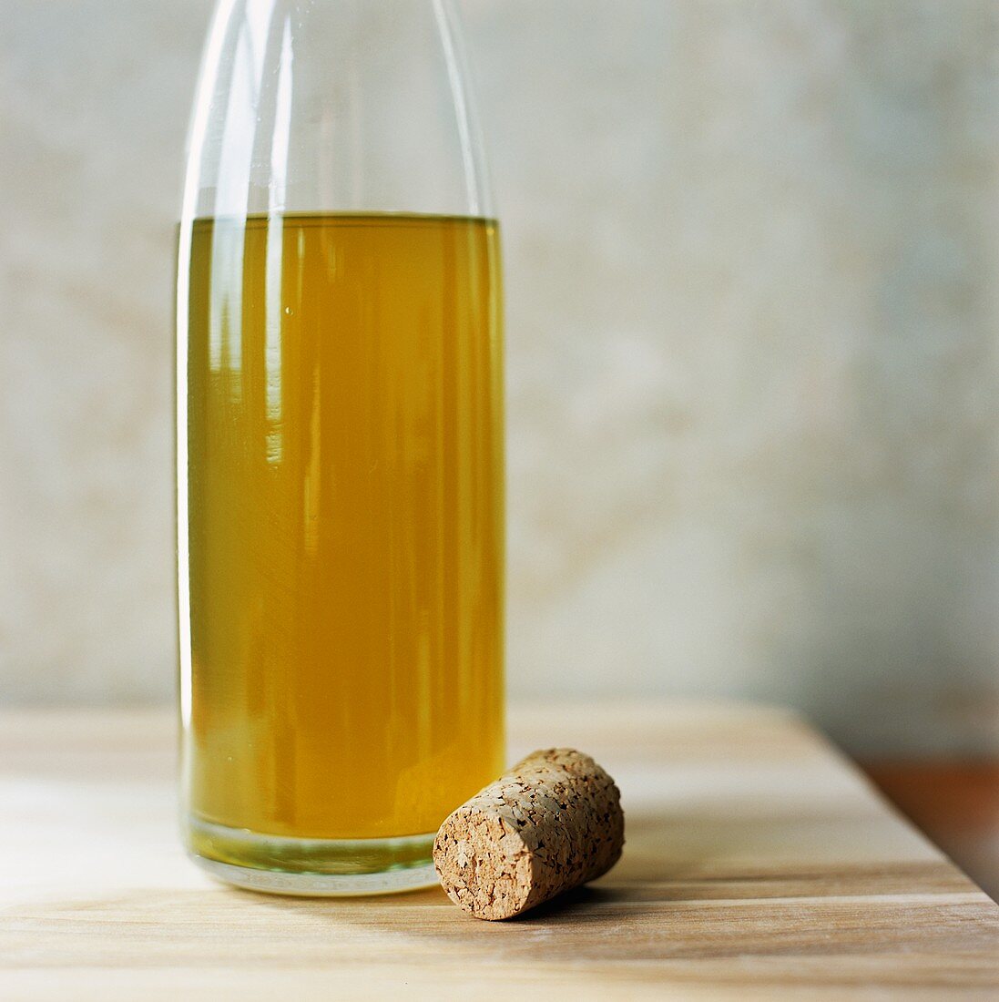 Bottle of cider vinegar, cork beside it