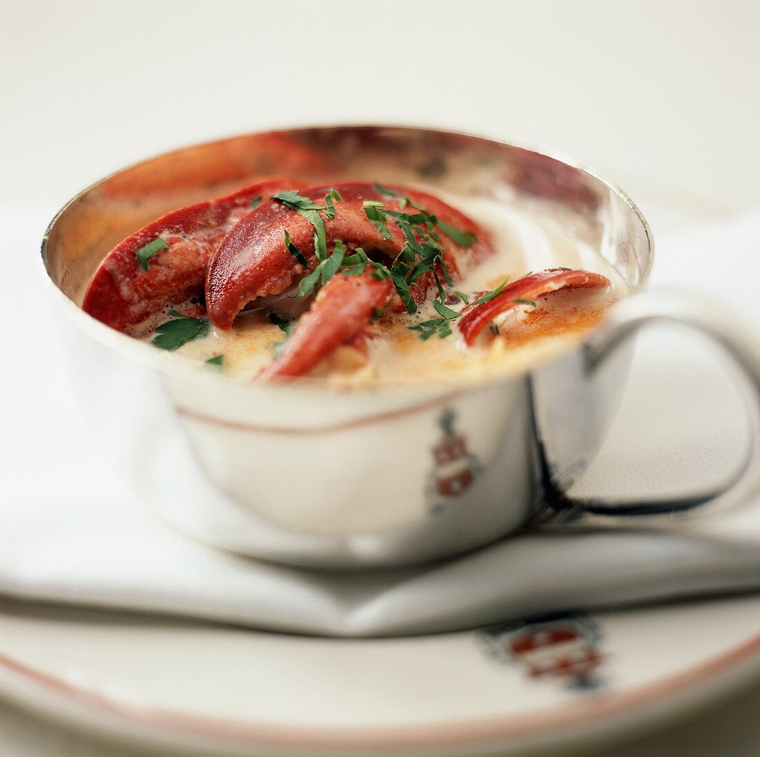 Lobster Bisque (lobster soup) in silver cup