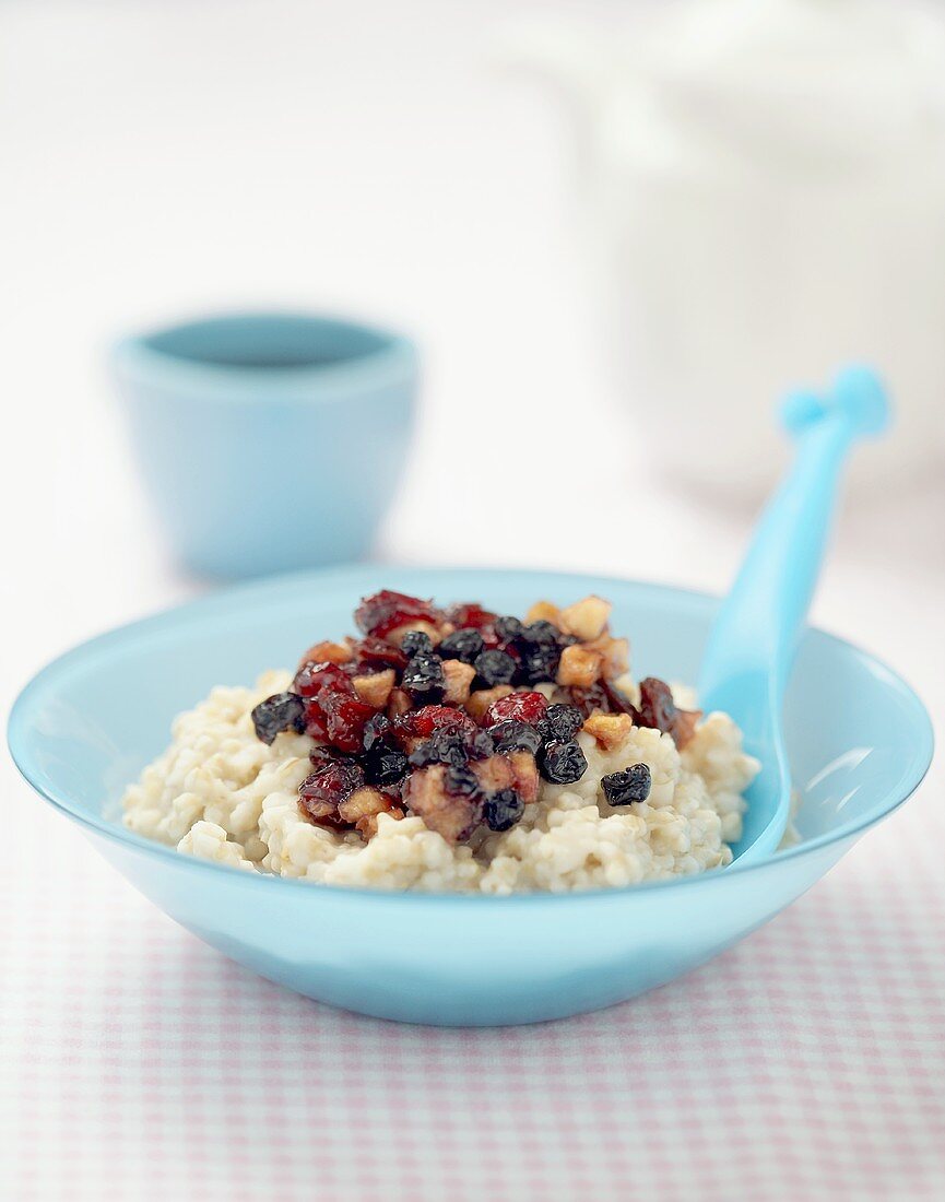 Porridge with dried fruit and cup of coffee