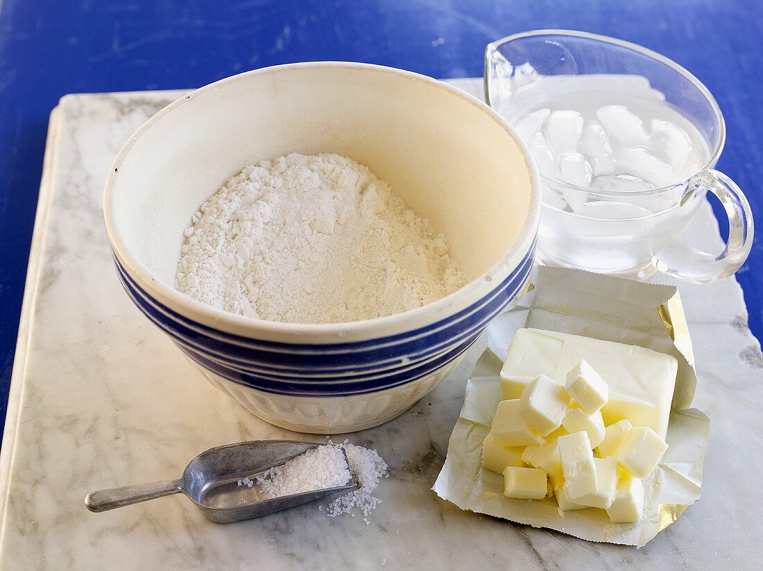Ingredients for pie crust: flour, salt, butter, iced water