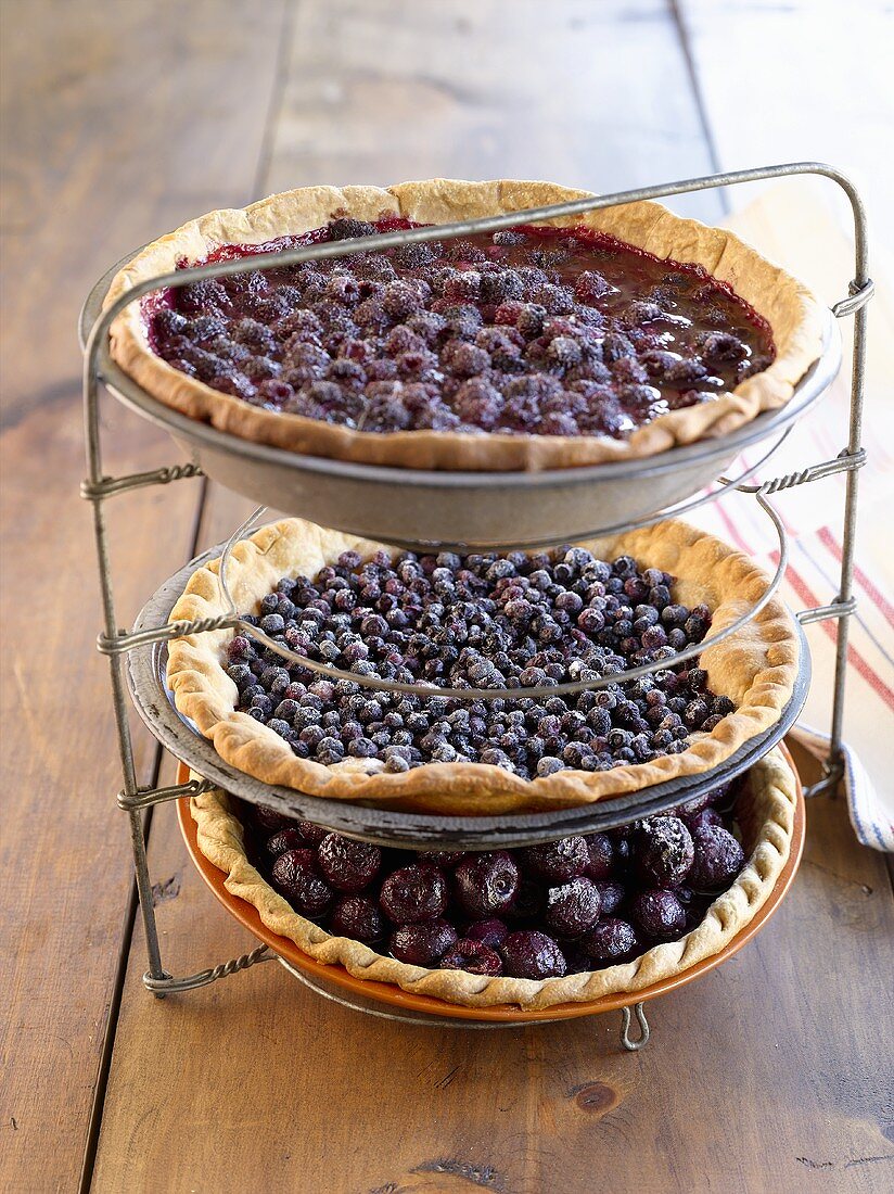 Three different fruit tarts on tiered stand (USA)