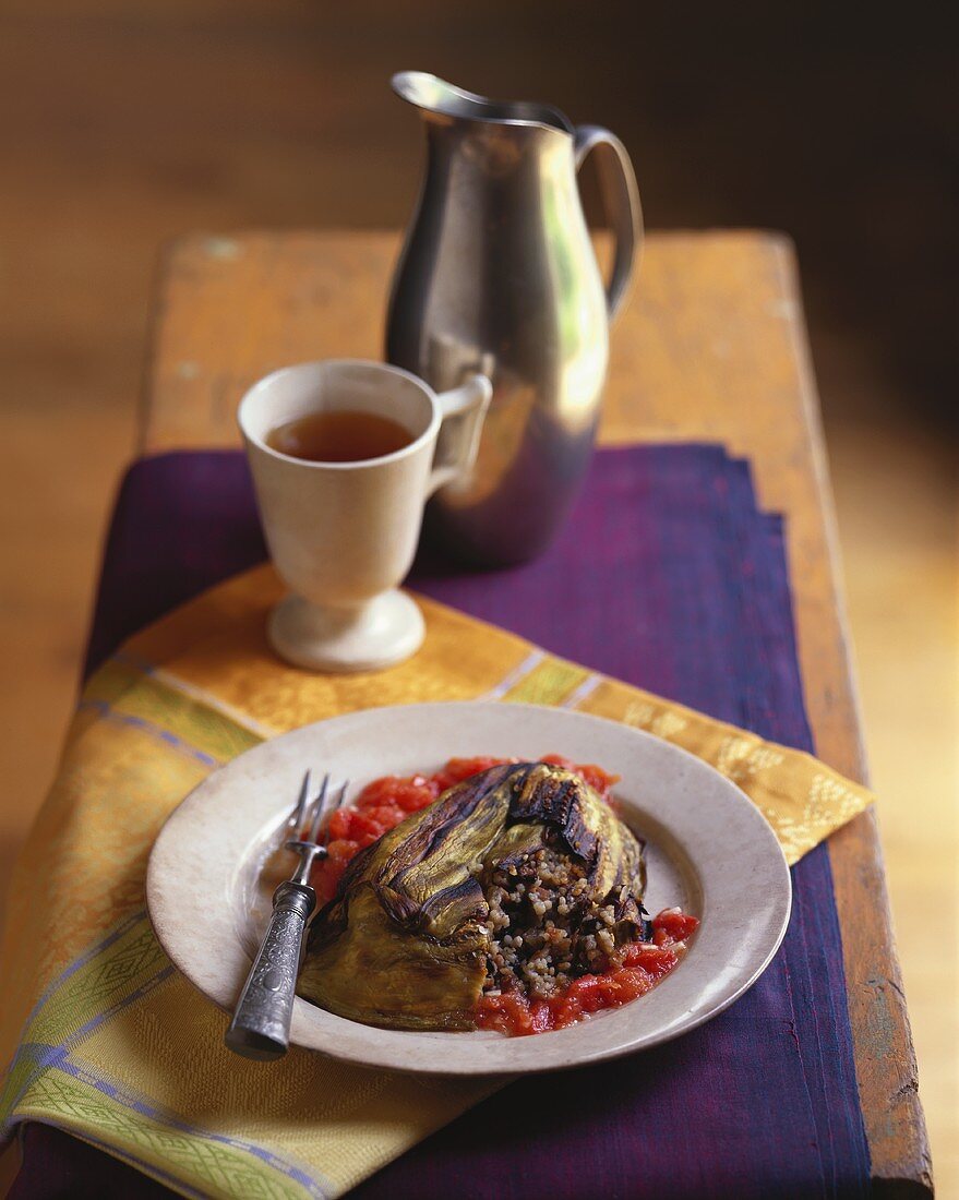 Aubergine terrine with couscous, pancetta, portobello, tomatoes