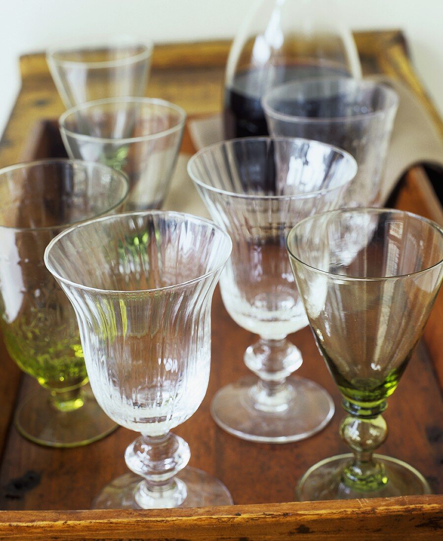 Assorted glasses on wooden tray
