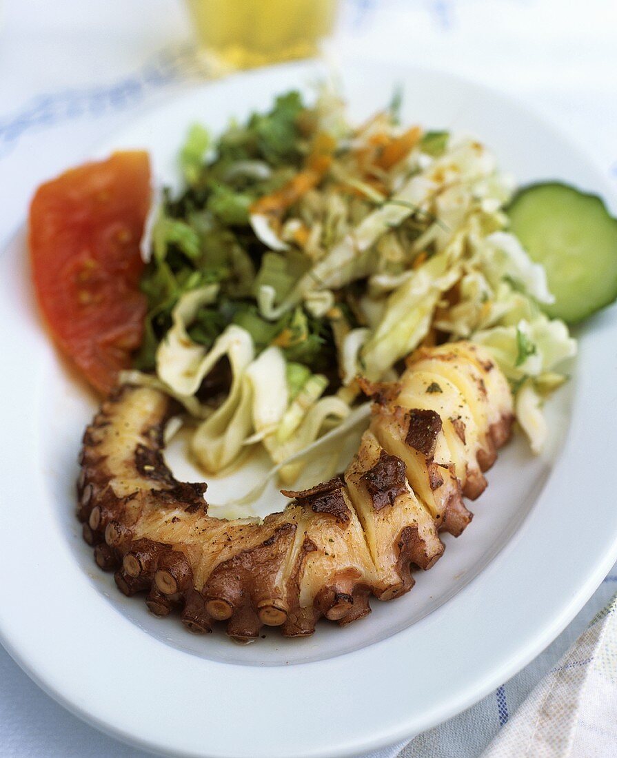 Grilled octopus with salad