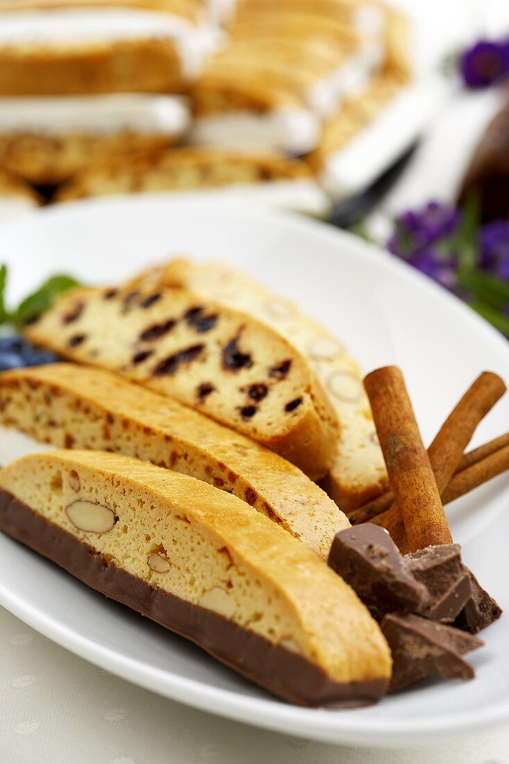 Assorted Pieces of Biscotti on a Plate with Chocolate and Cinnamon Sticks