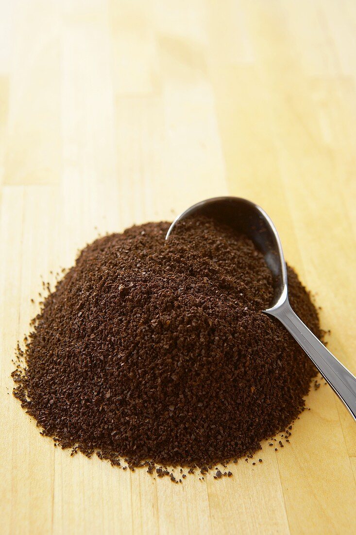 Pile of Ground Coffee with Coffee Scoop