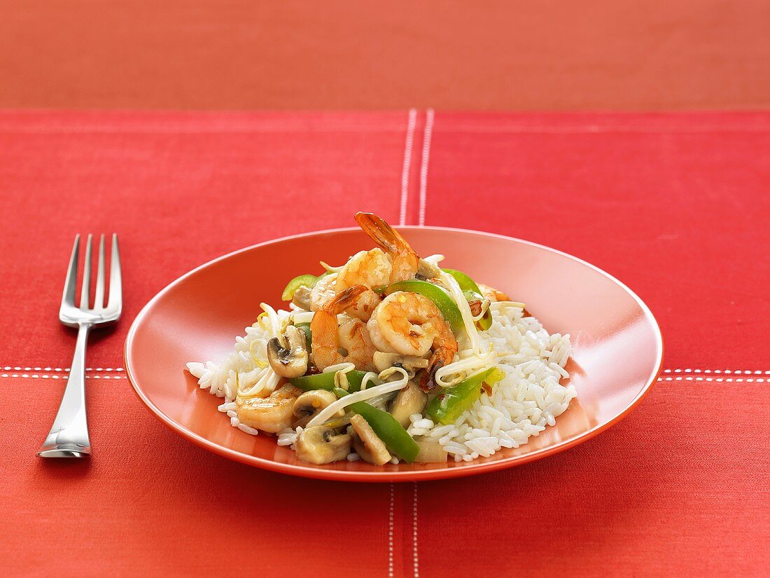 Szechwan Shrimp Over White Rice on a Plate, Fork