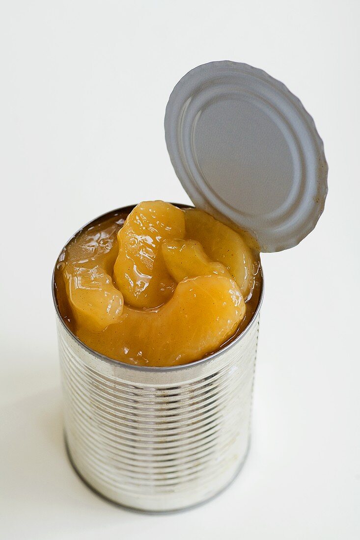 Opened Can of Apple Pie Filling on a White Background