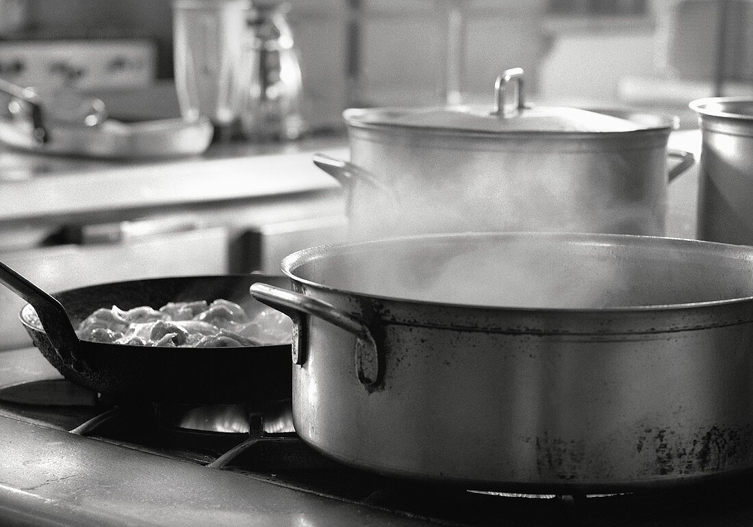 Stockpots Steaming on a Commerical Kitchen Stove