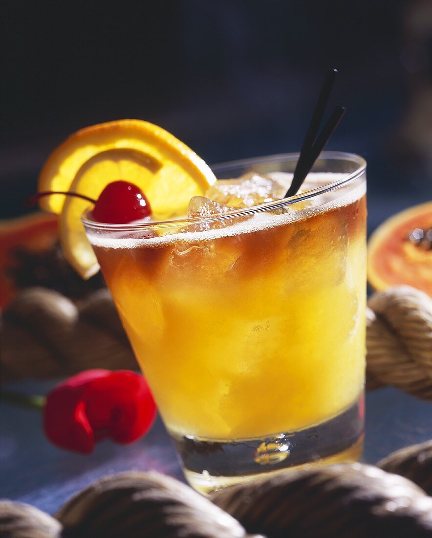 Rum Drink with Orange and Cherry Garnish