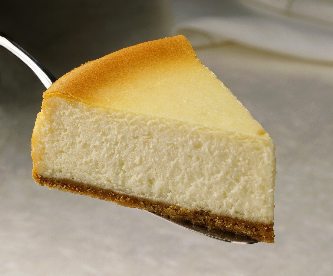 Slice of cheesecake on cake server