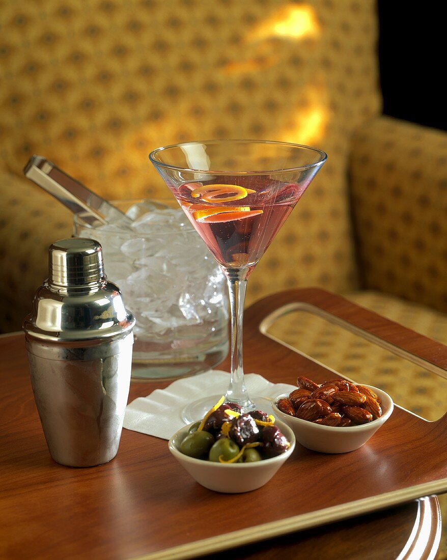 Cosmopolitan Martini; ice cubes; shaker; snacks