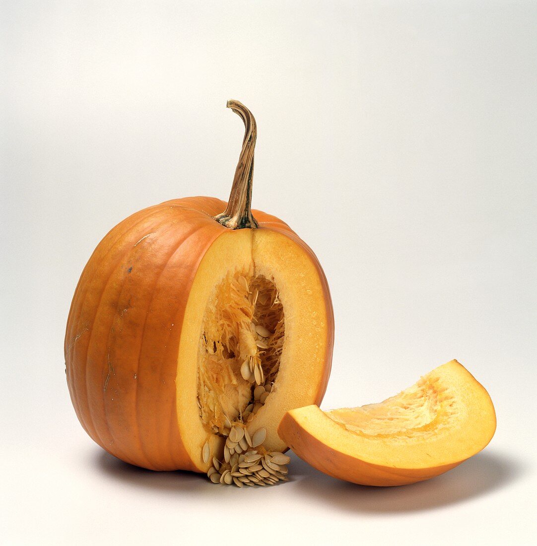 Two Pumpkins; One with a Piece Cut