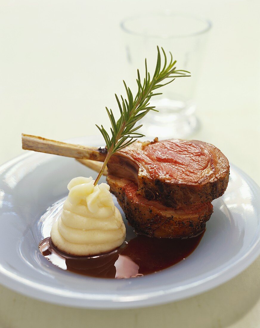 Lamb Chops with Mashed Potatoes and a Sprig of Rosemary