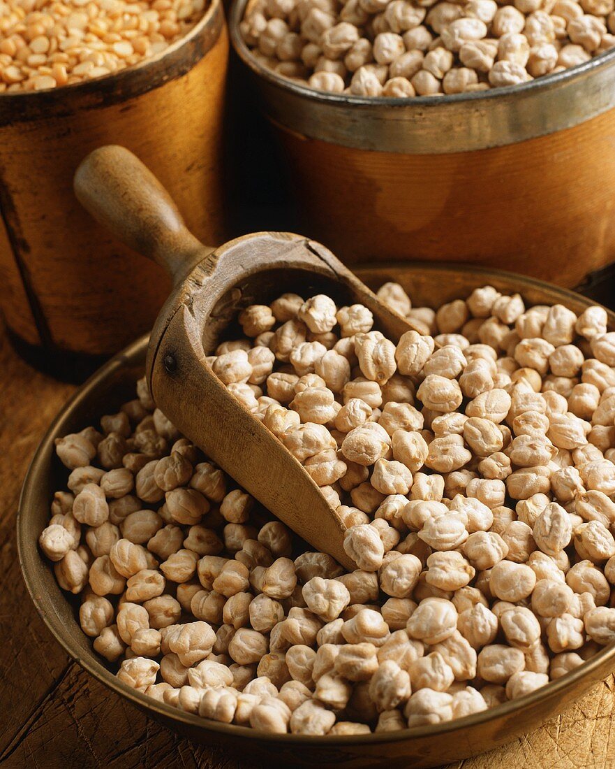 Dried Garbanzo Beans in a Bowl with a Wooden Scoop