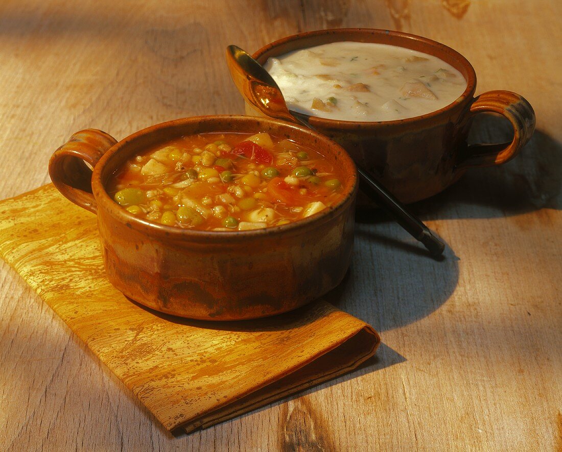 Manhattan and New England Clam Chowder in Bowls