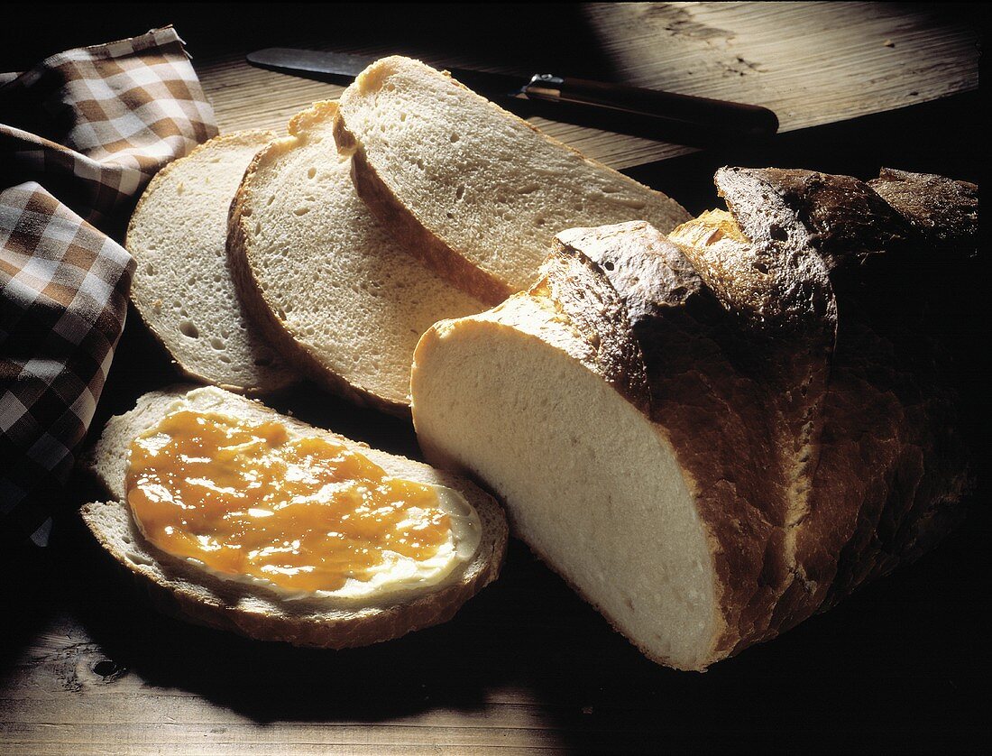White Bread Loaf and Slices; Butter and Marmalade