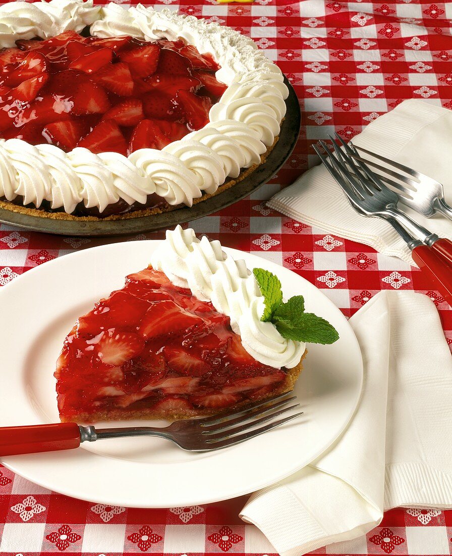 Slice of Strawberry Glaze Pie with Whole Pie