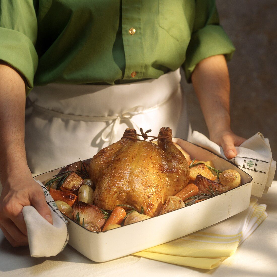 Holding a Roasted Chicken Dinner