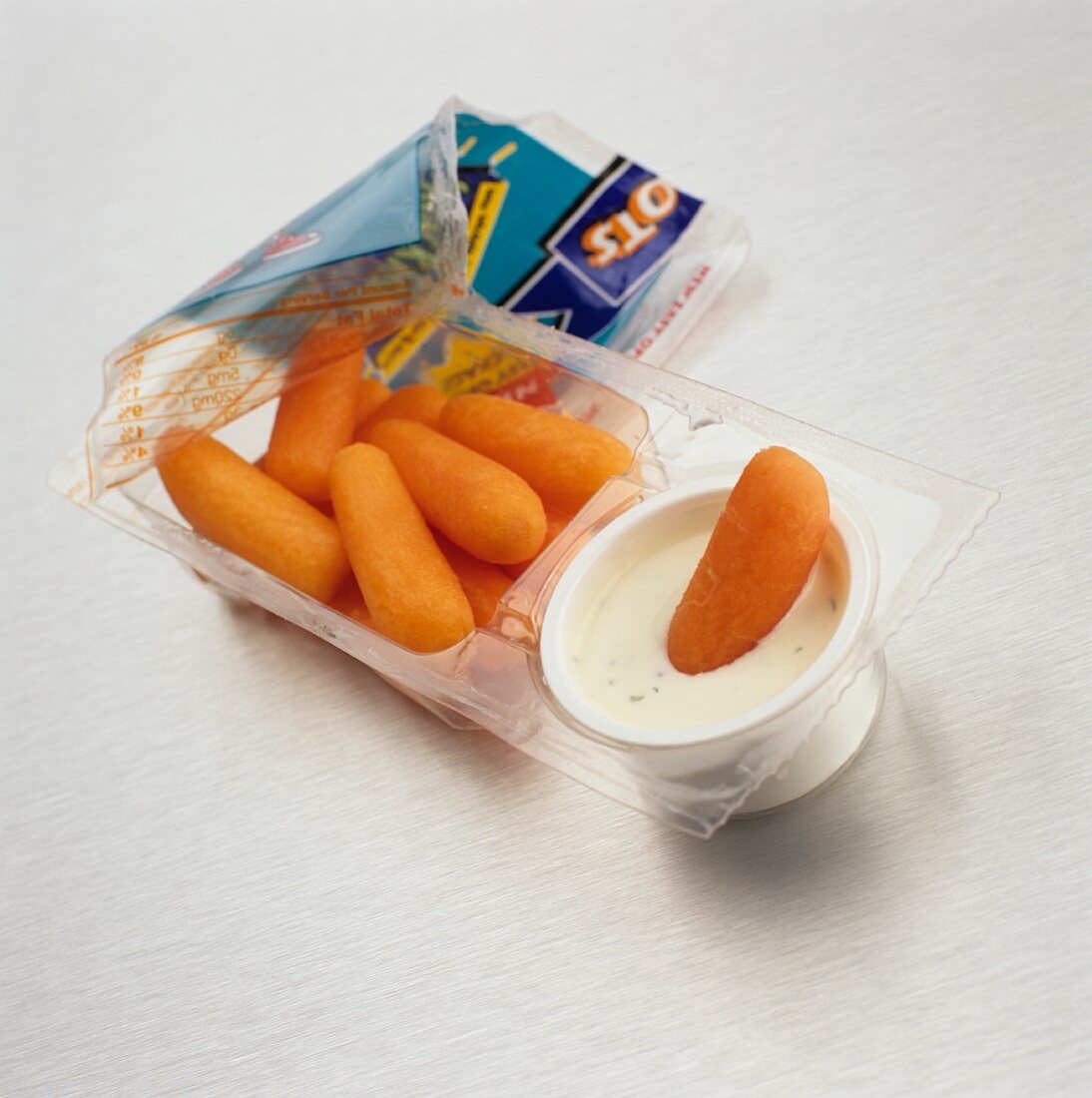 Baby Carrots and Dip Snack Pack; Opened with Carrot Dipped into Dip