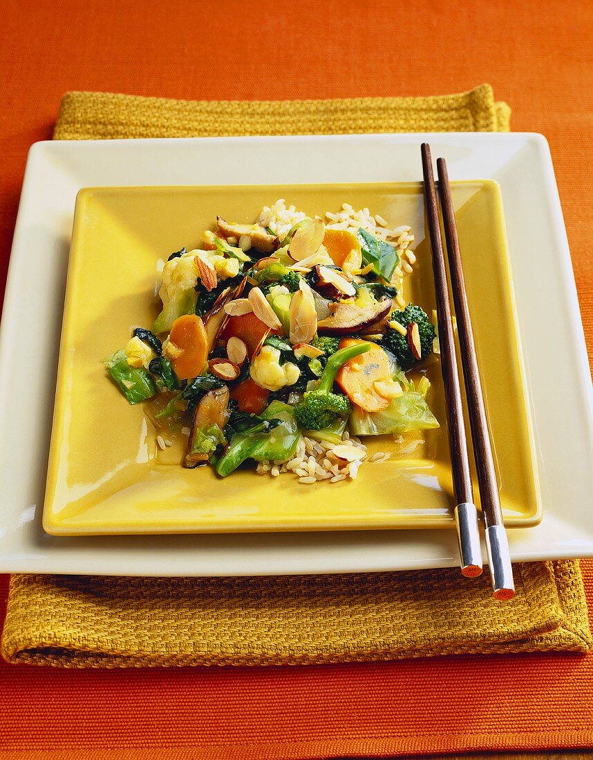 Vegetable Stir-Fry with Almonds on a Bed of Rice