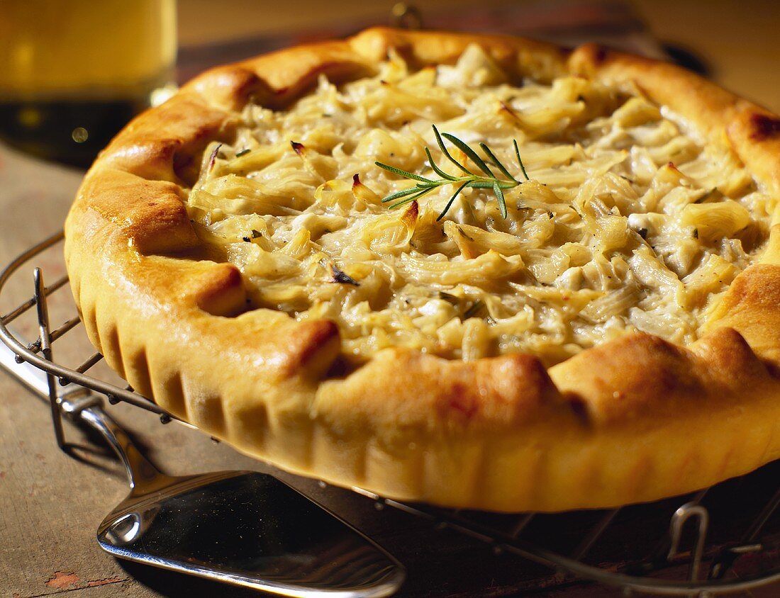 Caramelised onion and cheese tart on a cooling rack