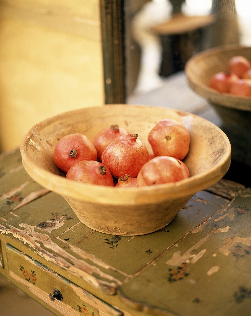 Pomegranates in a terracotta bowl