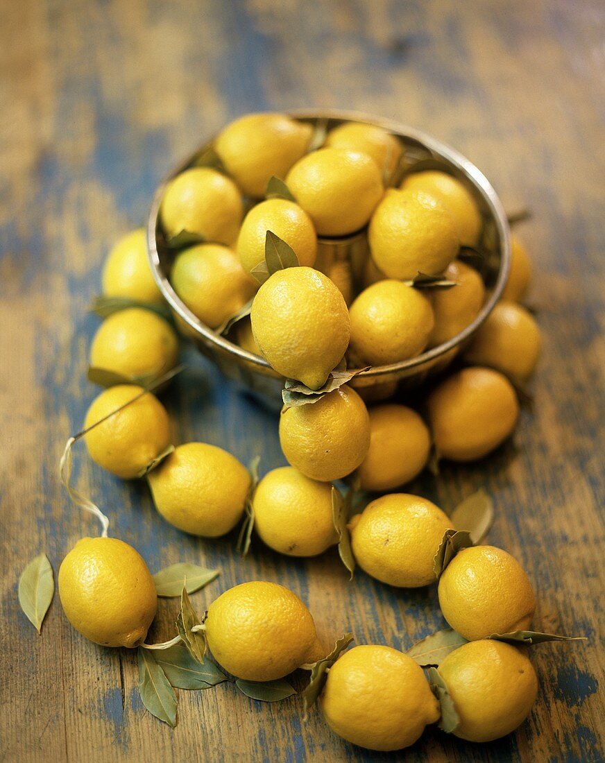 Lemons in bowl and threaded on kitchen string