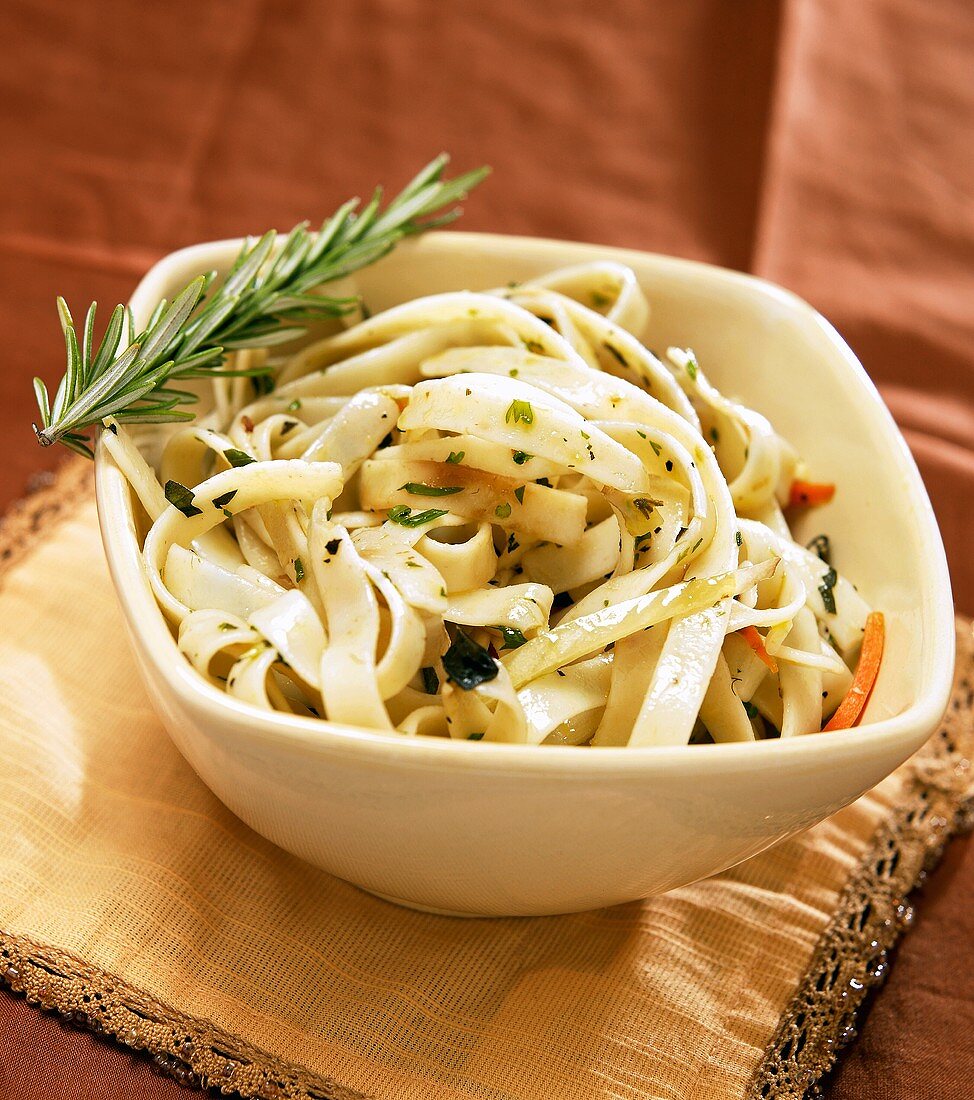 Bowl of Fettucini with Roasted Vegetables and Rosemary Sprig