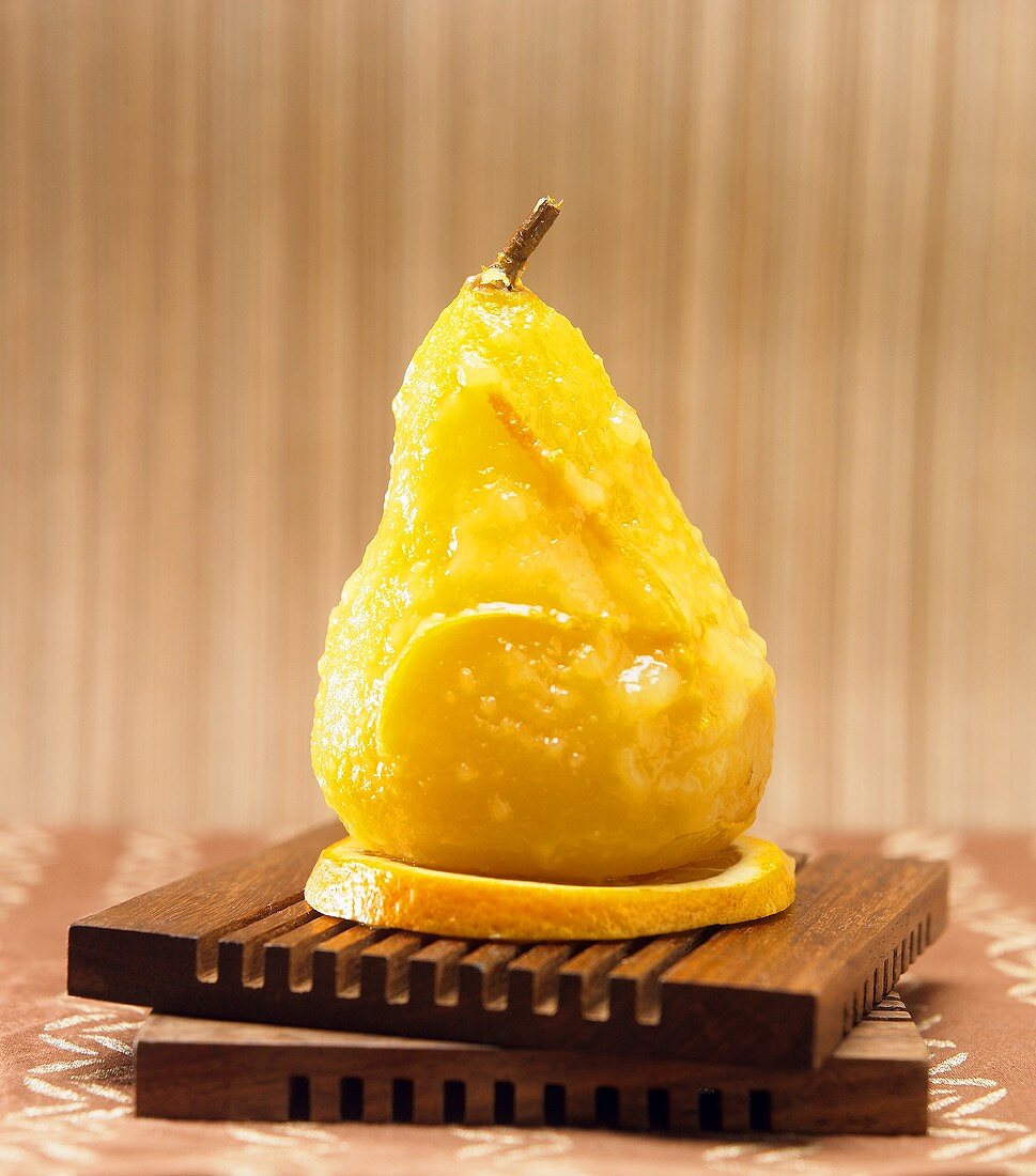 Single Orange Glazed Pear on an Orange Slice