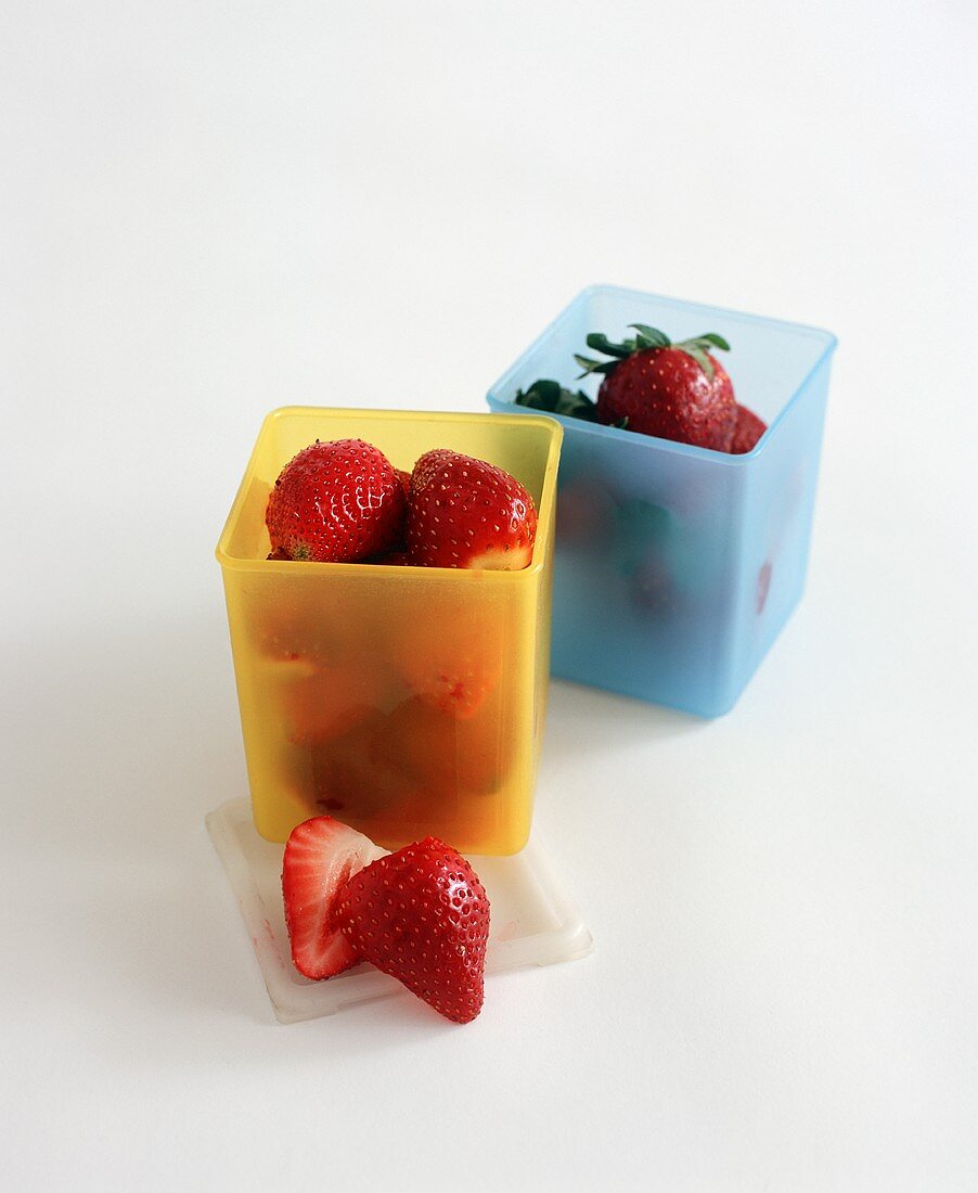 Strawberries in Colorful Storage Containers
