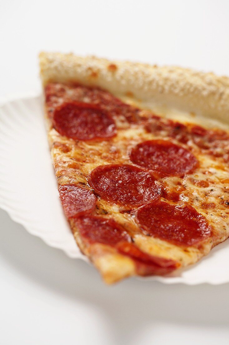 Close Up of a Slice of New York City Style Pepperoni Pizza