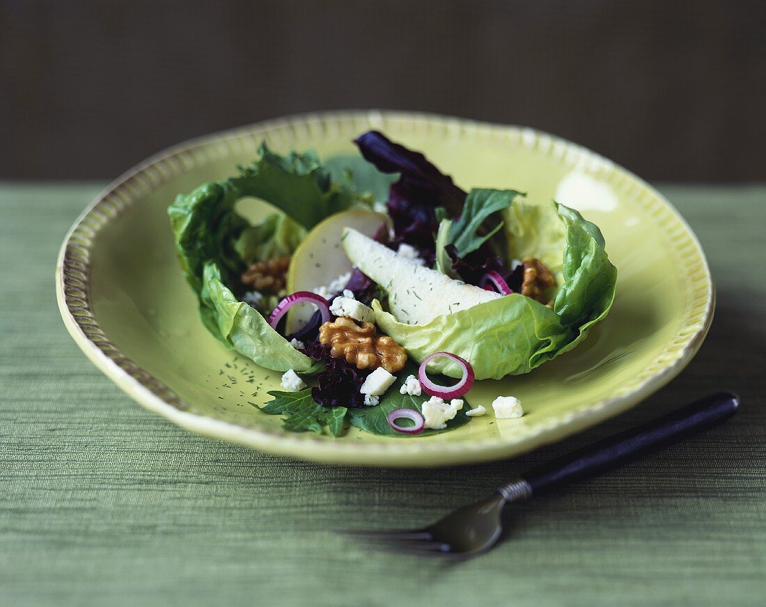 Salad with Pear Slices, Walnuts and Crumbled Goat Cheese