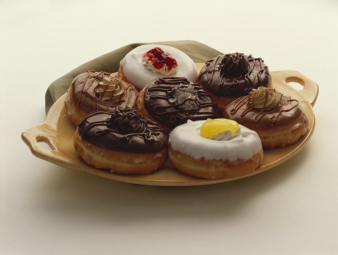 A Platter of Filled Donuts with Assorted Frosting