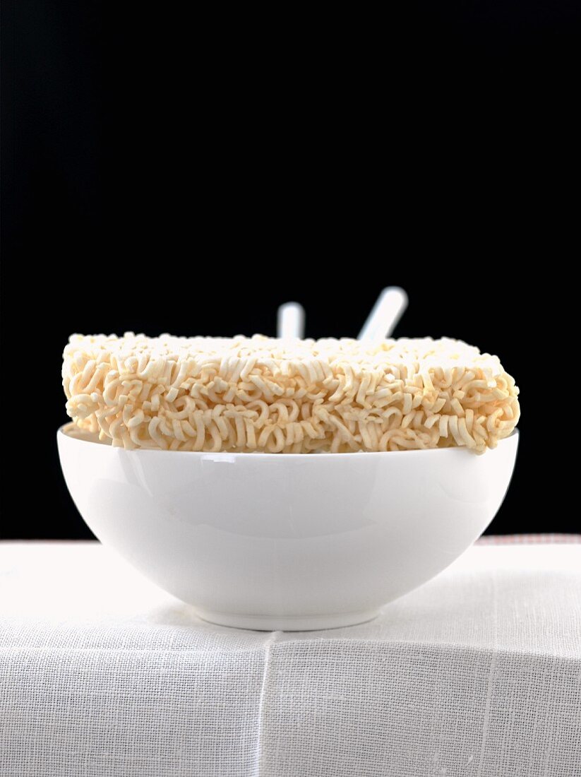 Dried Curly Noodles on a White Bowl